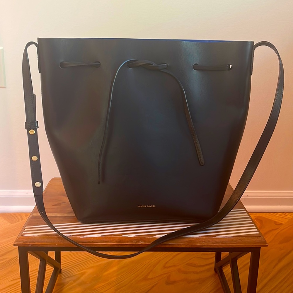 Black Mansur Gavriel bucket crossbody bag with blue interior. Great condition.